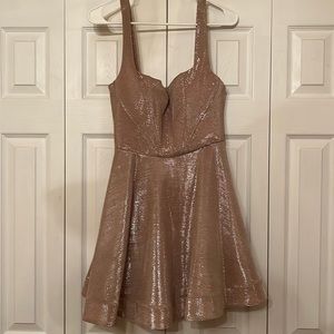 A cool toned pink flare mini dress with silver glitter
